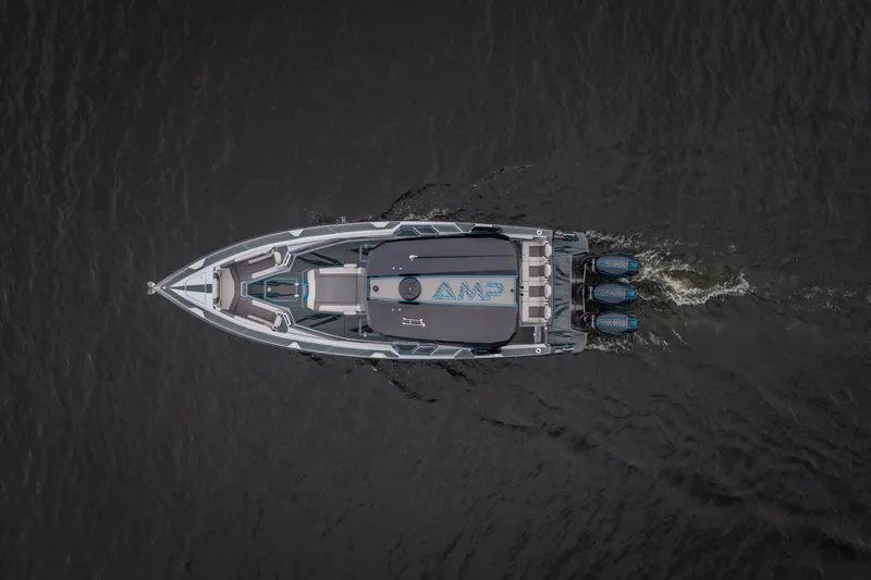 Slide: The Image of Aerial view of 2025 AMP 333 CC boat cruising on water with powerful engines. - 4
