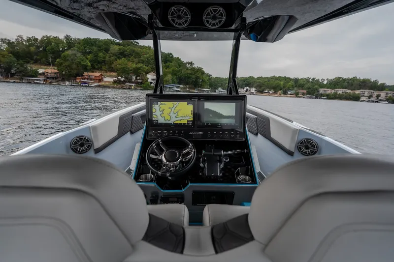 Slide: The Image of Interior view of 2025 AMP 333 CC boat cockpit with advanced navigation system. - 42