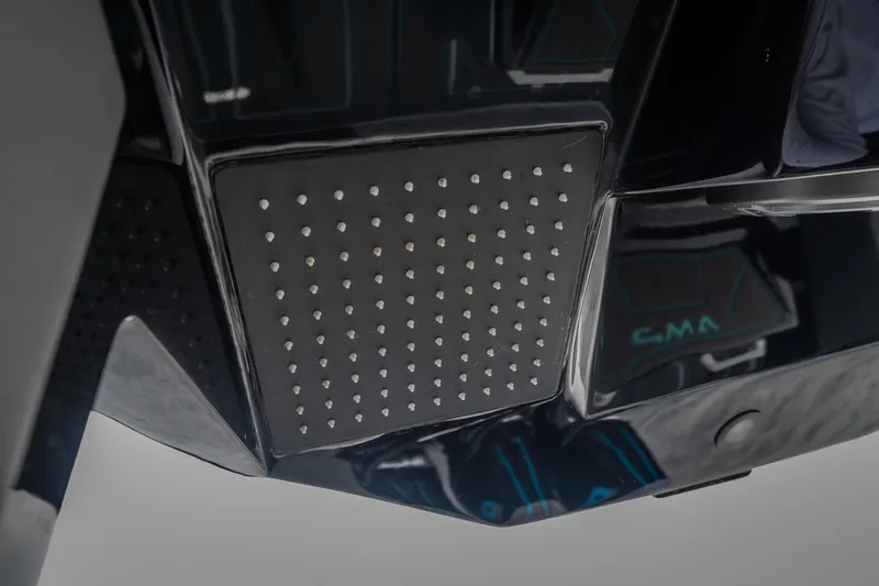 Slide: The Image of Close-up of AMP 333 CC 2025 model's sleek black panel with dotted texture. - 43