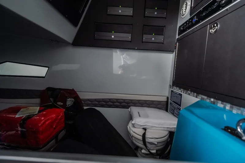 Slide: The Image of Interior of 2025 AMP 333 CC boat with storage compartments and equipment. - 85