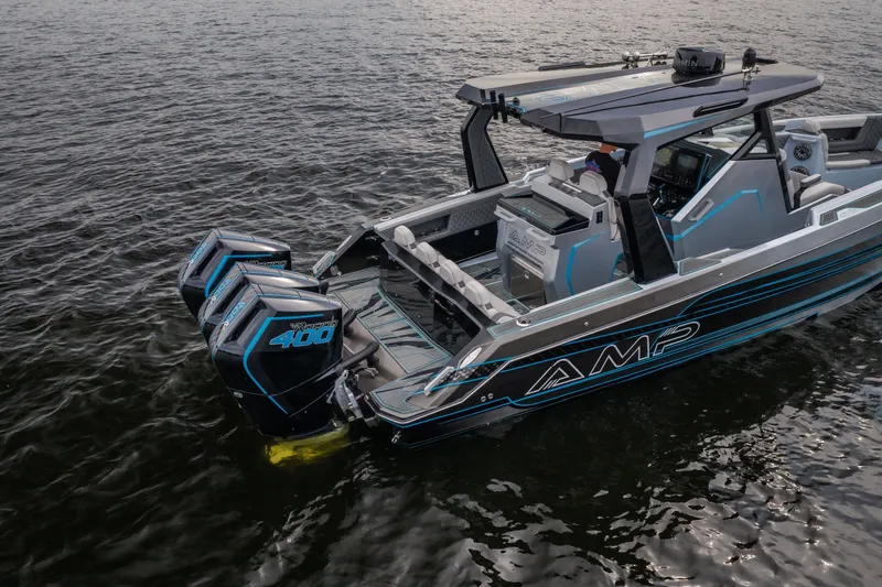 Slide: The Image of 2025 AMP 333 CC boat with twin 400 horsepower engines on water. - 71