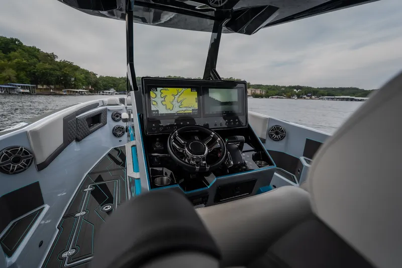 Slide: The Image of Interior view of 2025 AMP 333 CC boat cockpit with advanced navigation system. - 15