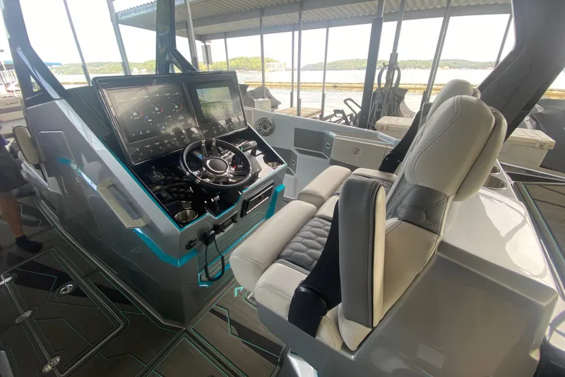 Slide: The Image of Modern AMP 333 CC 2025 boat cockpit with advanced controls and comfortable seating. - 16