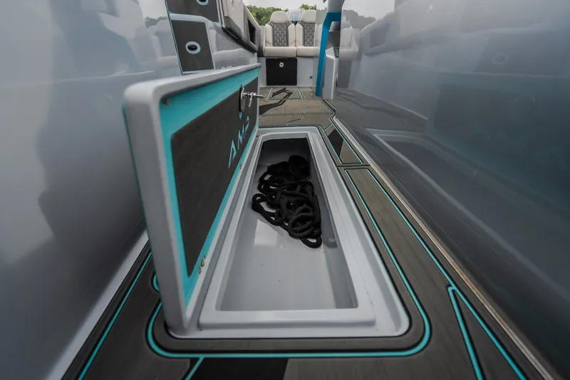 Slide: The Image of Storage compartment on 2025 AMP 333 CC boat with rope inside. - 57