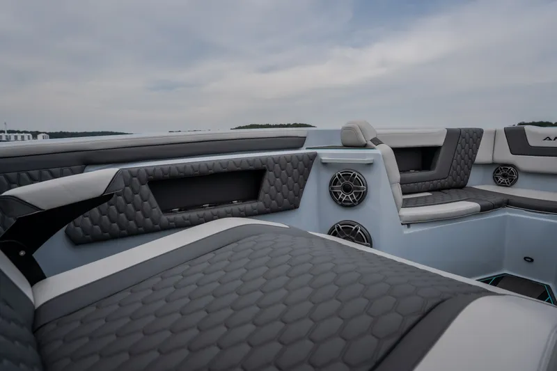 Slide: The Image of Luxurious interior of 2025 AMP 333 CC boat with quilted seating and speakers. - 32
