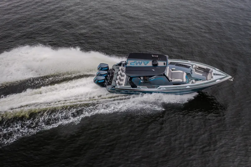 Slide: The Image of Aerial view of 2025 AMP 333 CC boat speeding on water with powerful engines. - 77