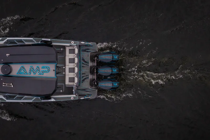 Slide: The Image of Aerial view of 2025 AMP 333 CC boat cruising on water. - 5