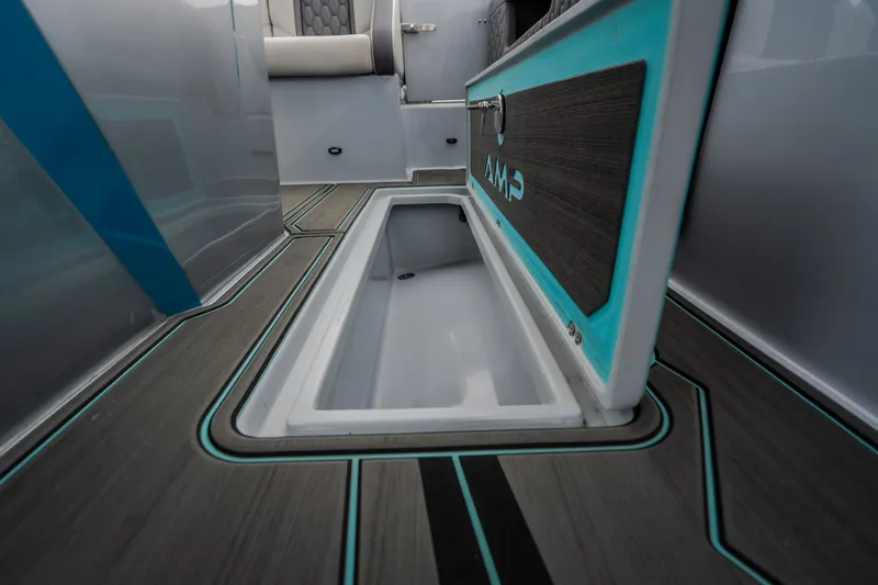 Slide: The Image of Interior of 2025 AMP 333 CC boat with sleek storage compartment and modern design. - 54