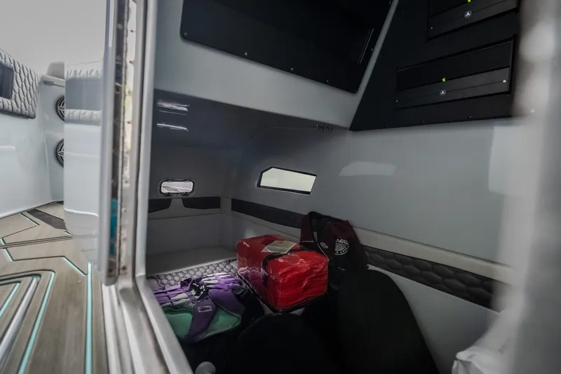 Slide: The Image of Interior cabin of 2025 AMP 333 CC boat with storage and seating area. - 84