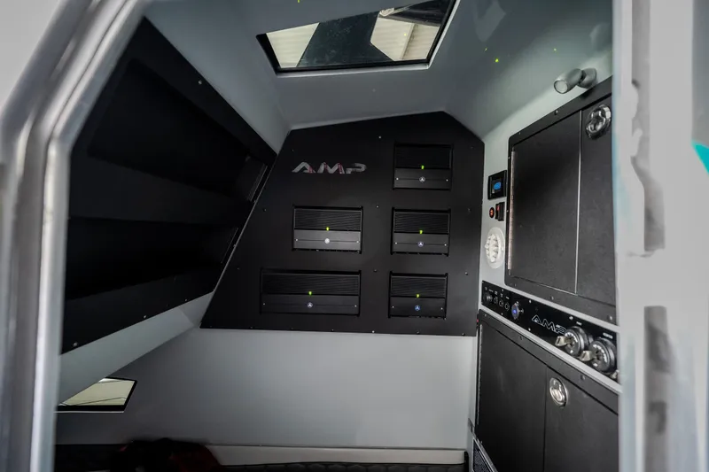 Slide: The Image of Interior of 2025 AMP 333 CC vehicle, featuring modern control panels and sleek design. - 81