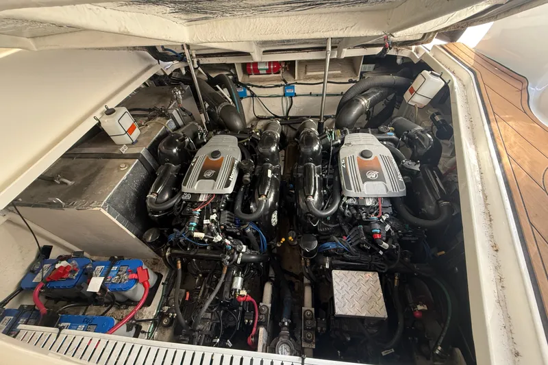 Slide: The Image of Engine compartment of 2010 Sea Ray Sundancer 330 with dual engines and battery setup. - 22