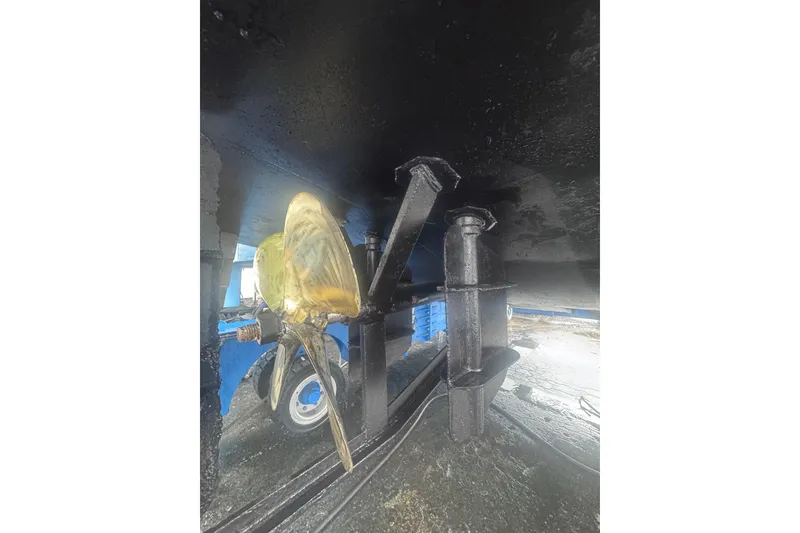 Slide: The Image of Golden propeller under a 2007 Progressive Industrial model boat, showcasing marine engineering. - 15