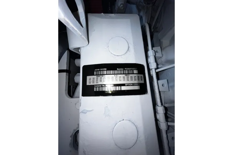 Slide: The Image of Label on industrial machinery, Progressive Industrial 2007 model, displaying serial and customer numbers. - 29
