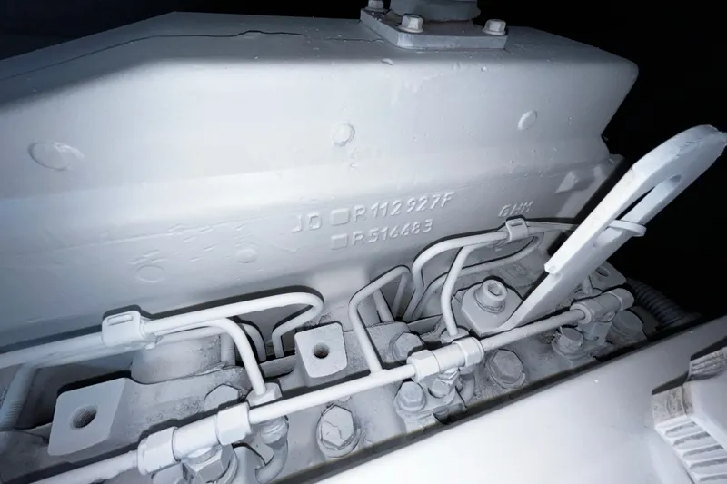 Slide: The Image of Close-up of a 2007 Progressive Industrial engine component with visible serial numbers. - 28