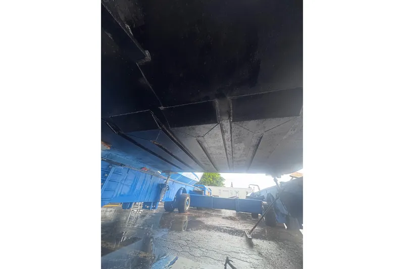 Slide: The Image of Underneath view of a 2007 Progressive Industrial vehicle, showcasing its structural details. - 18