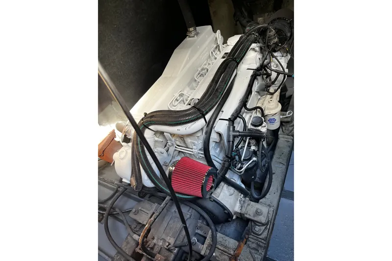 Slide: The Image of 2007 Progressive Industrial engine with red air filter and black hoses in a vehicle. - 22