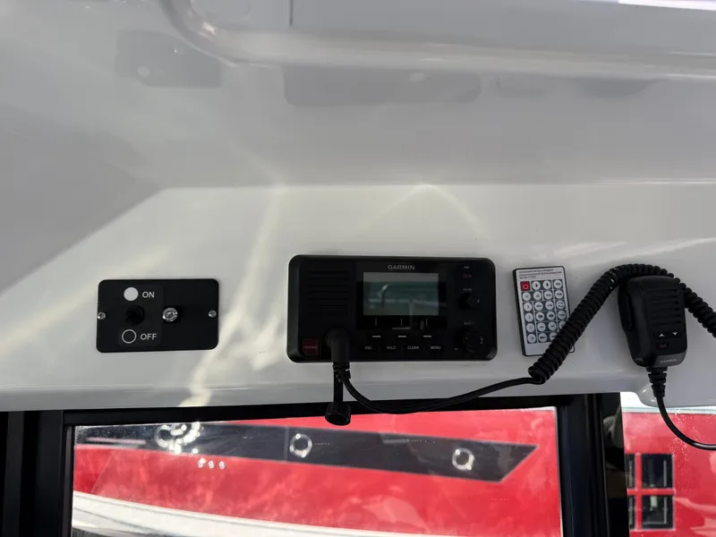 Slide: The Image of The image shows a control panel with a Garmin device, a switch, and a remote control. - 35