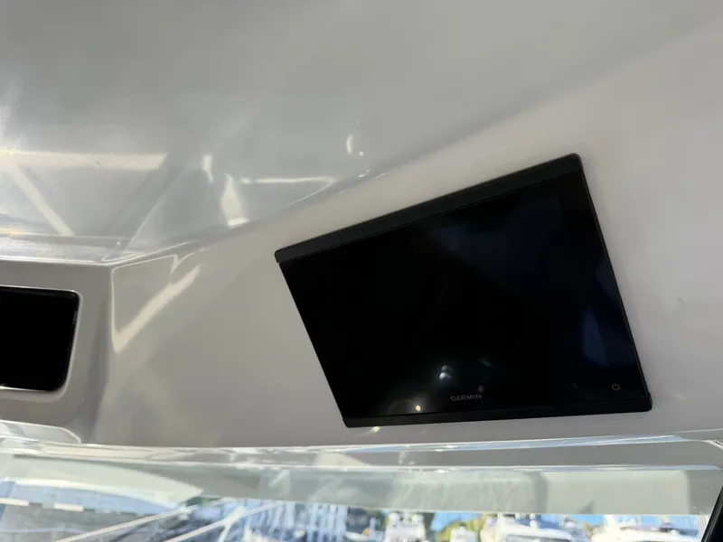 Slide: The Image of A modern navigation display is integrated into the ceiling of a boat. - 34