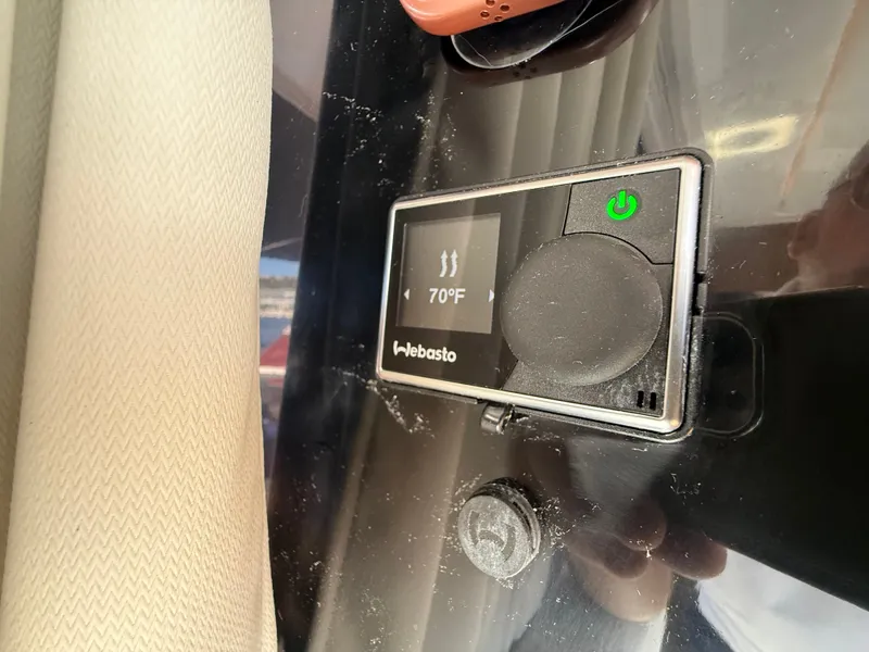 Slide: The Image of A Webasto heater control panel displays 70°F. It is located in a modern boat. - 28