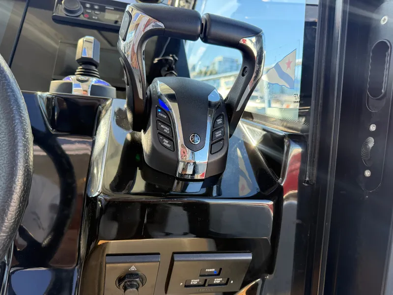 Slide: The Image of Close-up of the helm console on a Jeanneau NC 1095 Coupe with modern controls. - 30