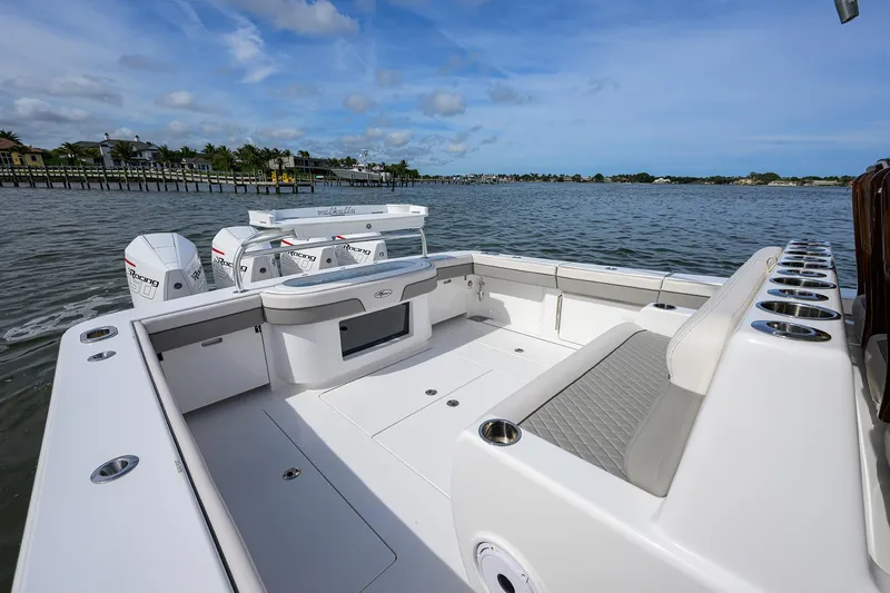 Slide: The Image of 2022 Valhalla Boatworks V-41 on water, spacious deck, luxury seating, and powerful engines. - 21