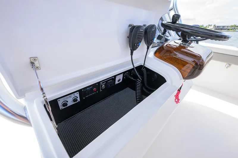 Slide: The Image of 2022 Valhalla Boatworks V-41 console with communication equipment and steering wheel. - 39