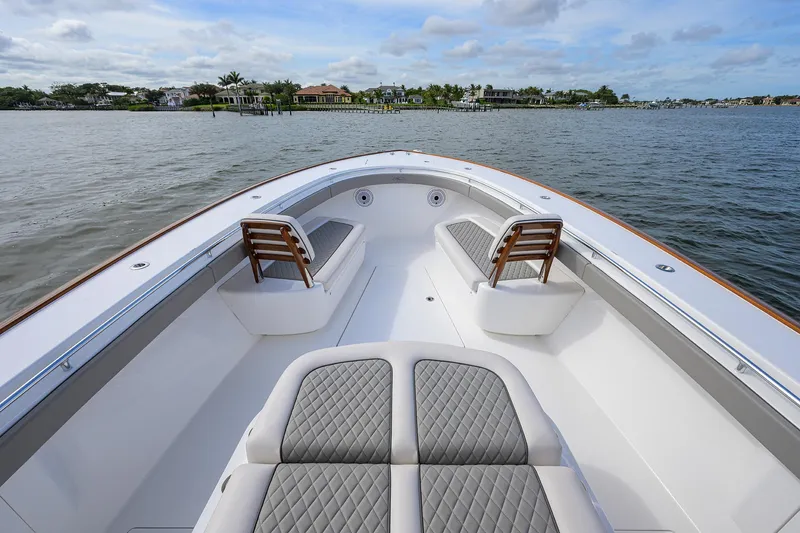 Slide: The Image of 2022 Valhalla Boatworks V-41 bow seating area on calm water. - 10