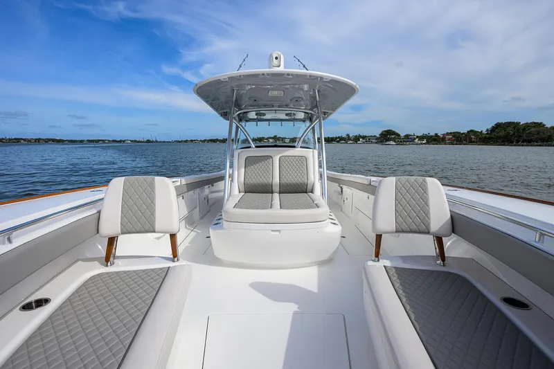 Slide: The Image of 2022 Valhalla Boatworks V-41 on calm waters, featuring luxurious seating and modern design. - 14