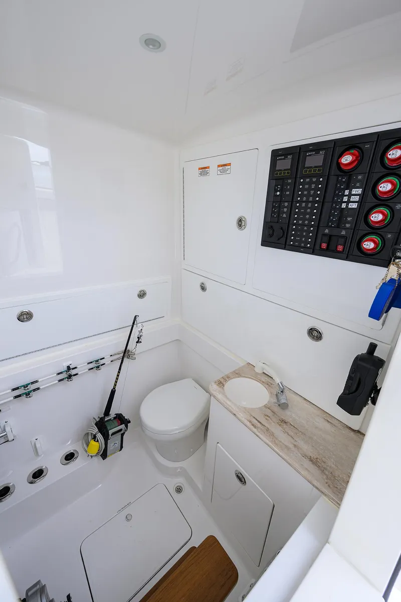 Slide: The Image of 2022 Valhalla Boatworks V-41 interior with control panel, toilet, and sink. - 38
