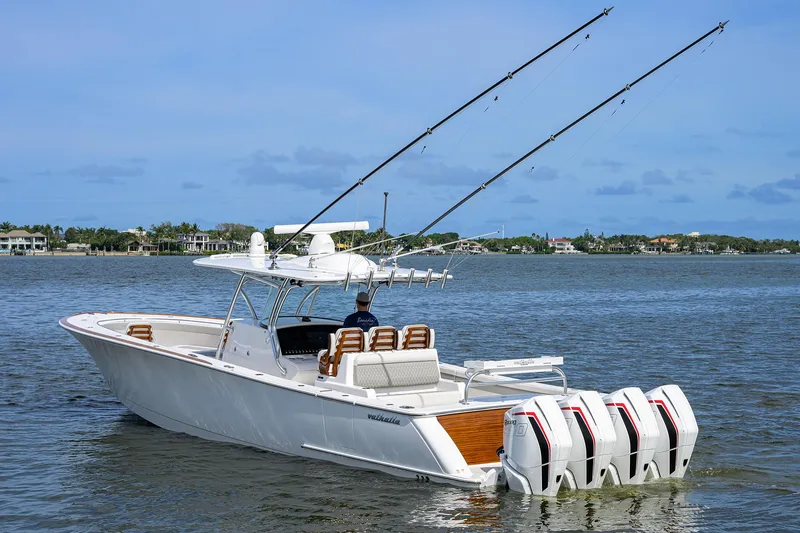 Slide: The Image of 2022 Valhalla Boatworks V-41 on water with fishing rods and four outboard engines. - 5