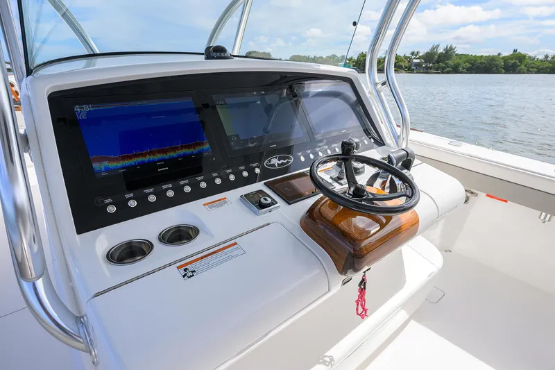 Slide: The Image of 2022 Valhalla Boatworks V-41 helm with advanced navigation displays and steering wheel. - 29