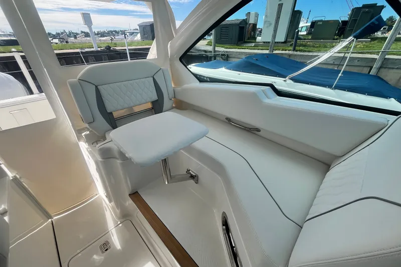 Slide: The Image of 2027 Pursuit DC 326 Dual Console interior with luxurious seating and modern design. - 17