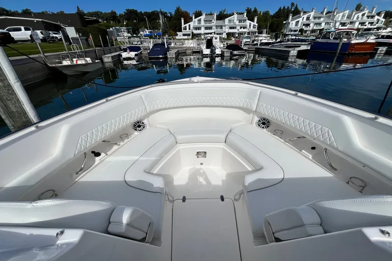 Slide: The Image of Luxurious 2027 Pursuit DC 326 Dual Console boat interior at marina. - 25