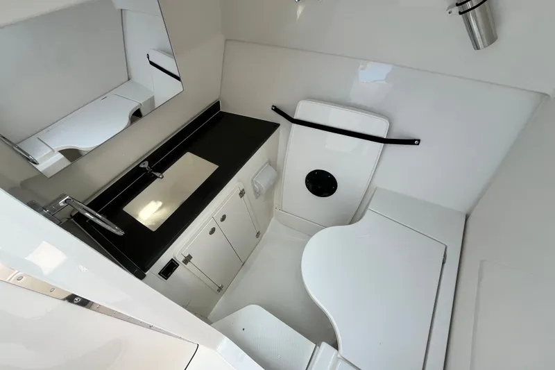Slide: The Image of 2027 Pursuit DC 326 Dual Console boat interior with sleek bathroom design. - 21