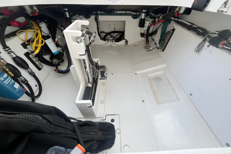 Slide: The Image of Interior view of 2027 Pursuit DC 326 Dual Console boat's engine compartment. - 6