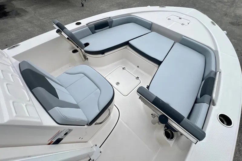 Slide: The Image of 2027 Robalo 226 Cayman boat interior with cushioned seating and sleek design. - 15