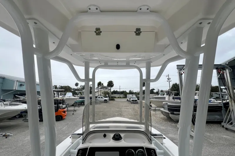 Slide: The Image of 2027 Robalo 226 Cayman boat interior with T-top and console view. - 14
