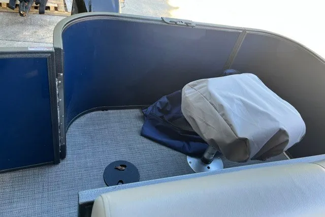 Slide: The Image of Interior of 2023 Bentley 180 LE boat with covered seat and carpeted floor. - 6