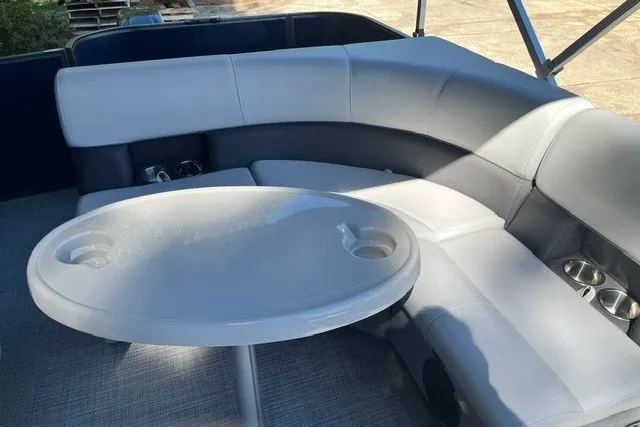 Slide: The Image of Luxurious seating area in a 2023 Bentley 180 LE boat with a sleek table design. - 5