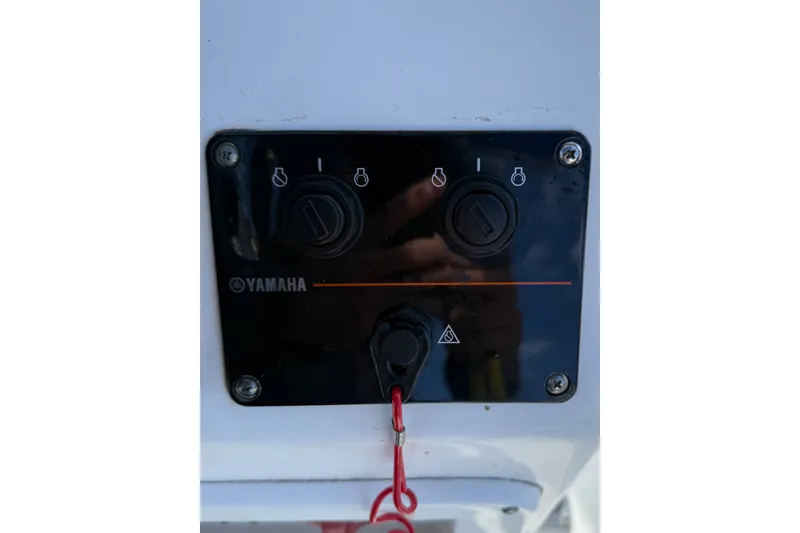 Slide: The Image of Control panel of a 2005 Edgewater 245CC boat with Yamaha switches. - 18