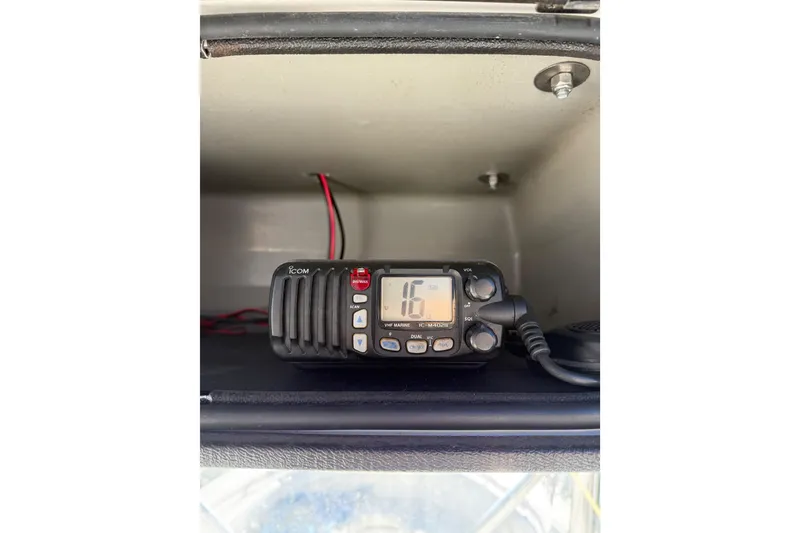 Slide: The Image of VHF marine radio inside a 2005 Edgewater 245CC boat compartment. - 7