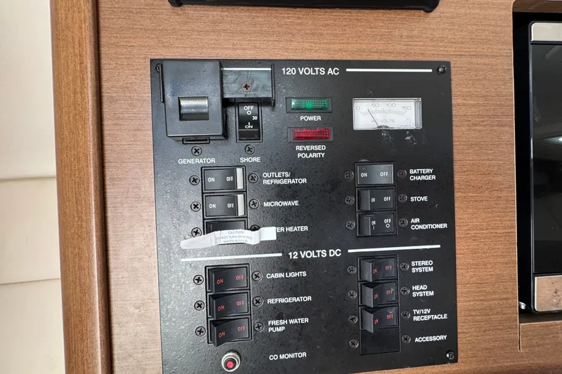 Slide: The Image of Electrical control panel on a 2018 Sea Ray Sundancer 260 boat. - 38