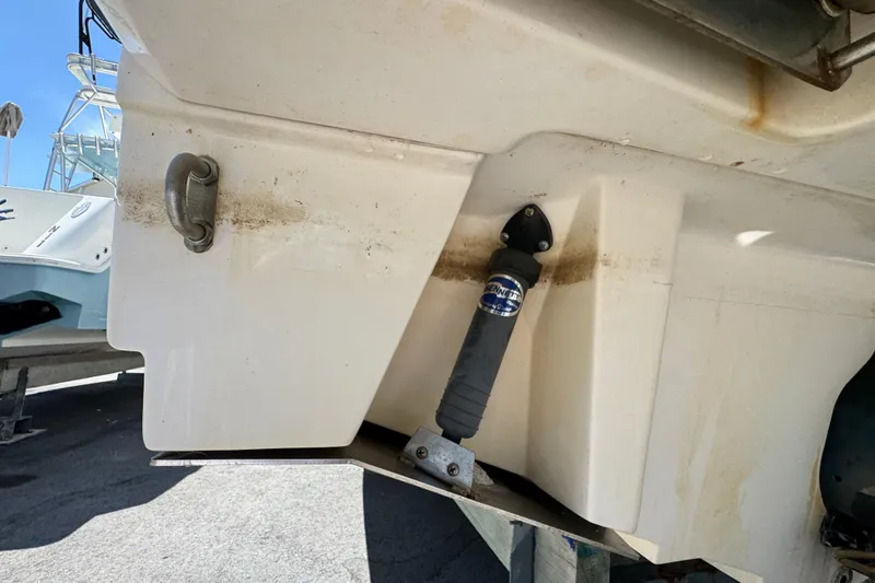 Slide: The Image of 2018 Sea Ray Sundancer 260 boat hull detail with trim tab and hydraulic actuator. - 77