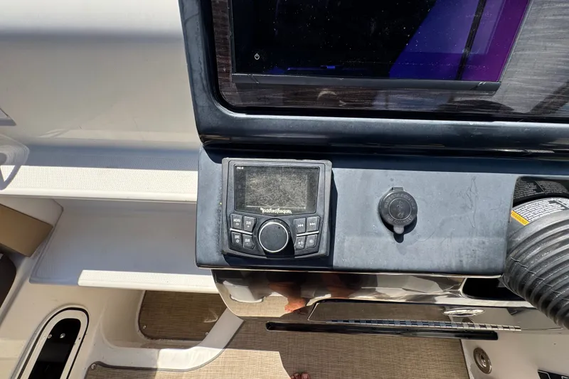 Slide: The Image of Control panel of a 2018 Sea Ray Sundancer 260 boat with navigation equipment. - 57
