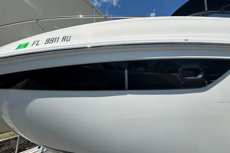 Slide: The Image of 2018 Sea Ray Sundancer 260 boat with registration FL 9911 RU, side view. - 8