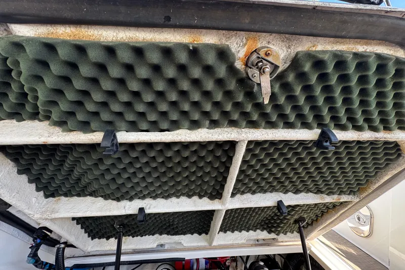 Slide: The Image of Engine compartment of 2018 Sea Ray Sundancer 260 with soundproofing foam panels. - 59