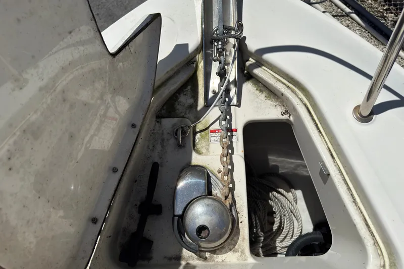 Slide: The Image of Anchor compartment of 2018 Sea Ray Sundancer 260 with chain and rope storage. - 28