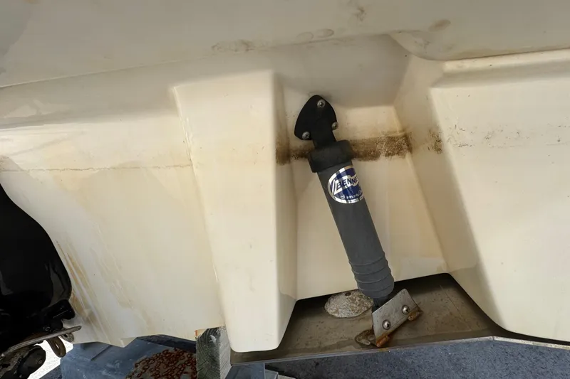 Slide: The Image of 2018 Sea Ray Sundancer 260 boat hull with trim tab actuator detail. - 84