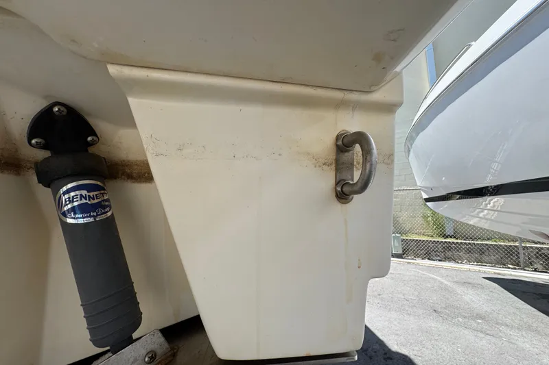 Slide: The Image of Close-up of 2018 Sea Ray Sundancer 260 boat hull with Bennett trim tab actuator. - 66