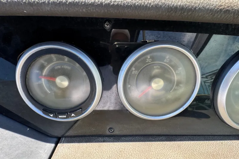 Slide: The Image of Dashboard gauges of a 2018 Sea Ray Sundancer 260 boat, showing RPM and speed in MPH. - 56